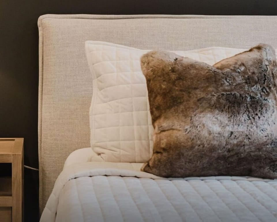 Unwind in comfort with a luxurious bed and serene ambiance.