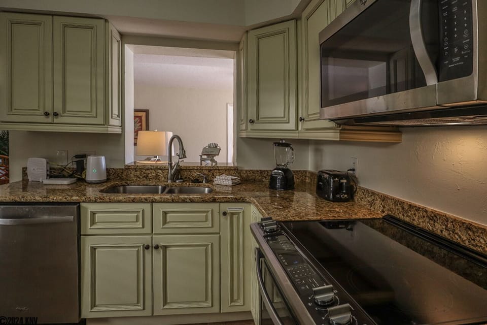 Fully Equipped Kitchen features granite countertops