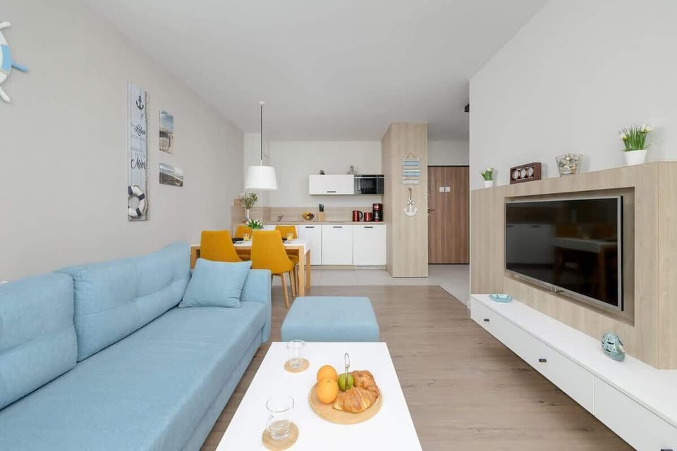 Living room with an exit to the furnished balcony