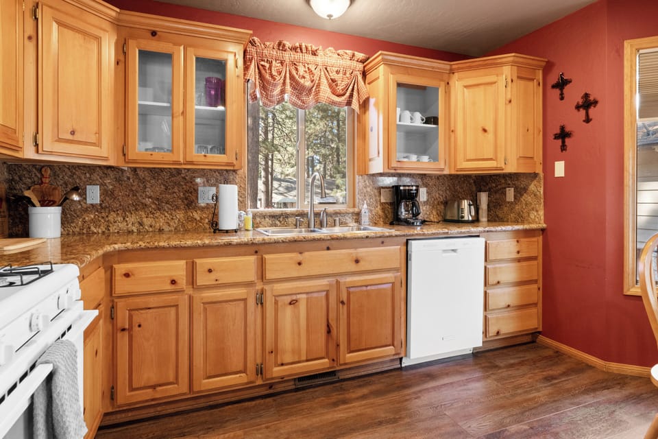 Kitchen - The eat-in kitchen features updated appliances and gleaming granite countertops. A French-door fridge and gas range make meal prep simple.