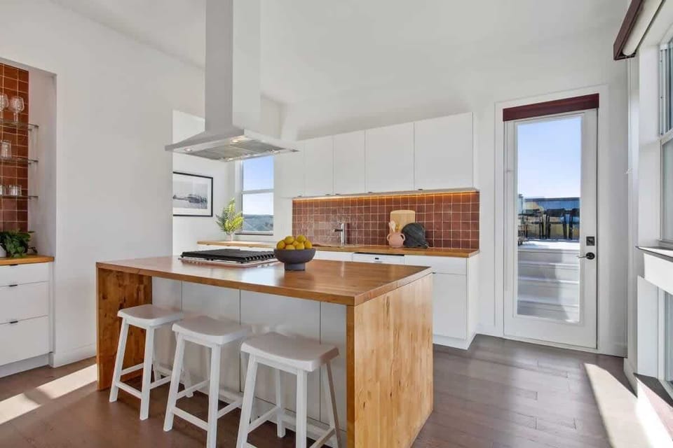 Kitchen | Fully Stocked Kitchen with Island and Bar Seating | Second Floor