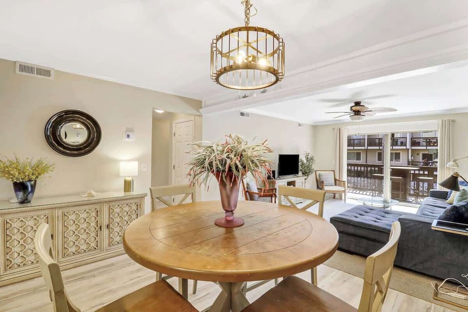 Your elegant dining space flows seamlessly into the living area, featuring a beautiful round table perfect for shared meals and memorable conversations.