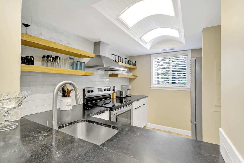 Your gourmet kitchen features sleek granite counters, modern appliances, and bright lights for cooking memorable meals.