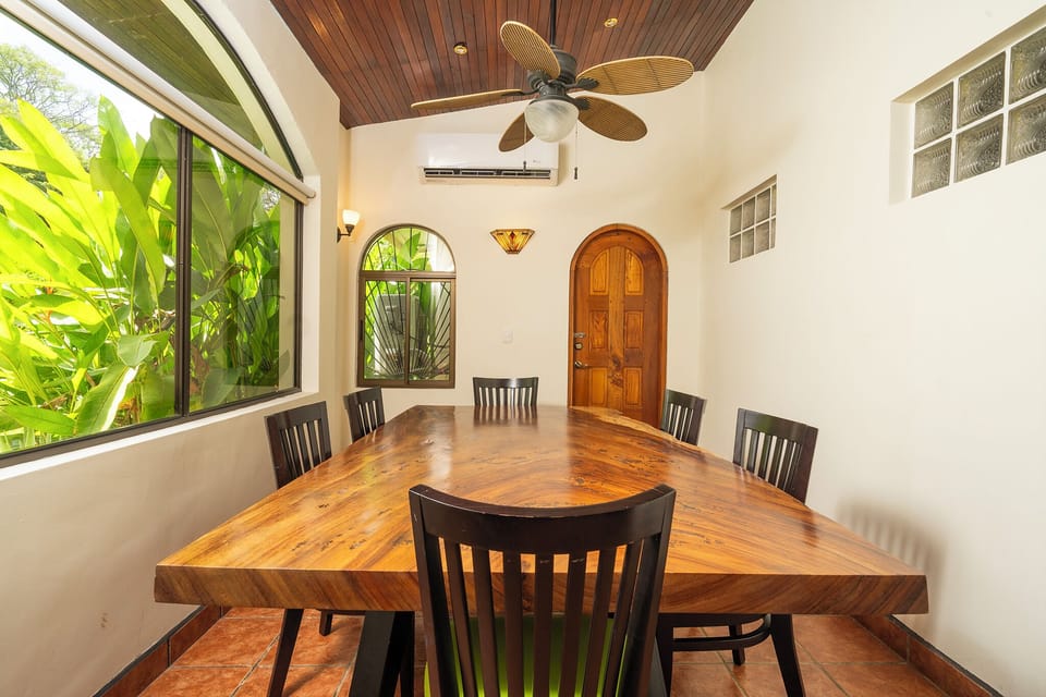 Dining room seats 10-12, overlooks garden and pool