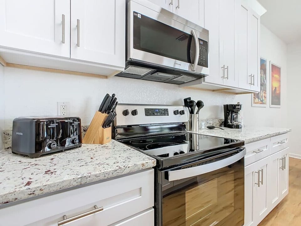 Open kitchen area with modern amenities, perfect for cooking and socializing.