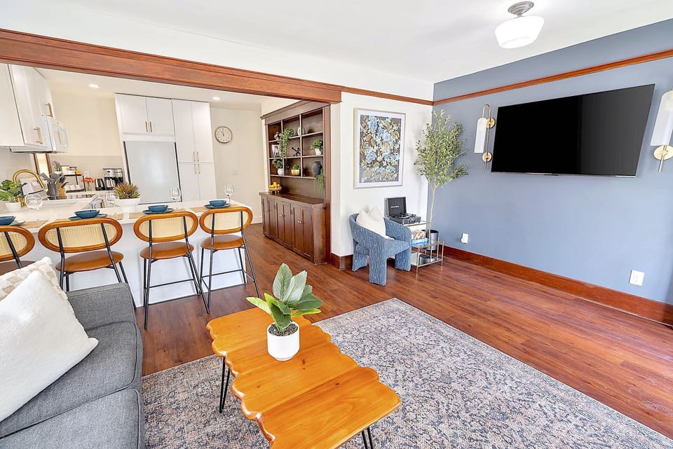 Cozy up in this stylish and comfortable Living Room, 58" TV and record player