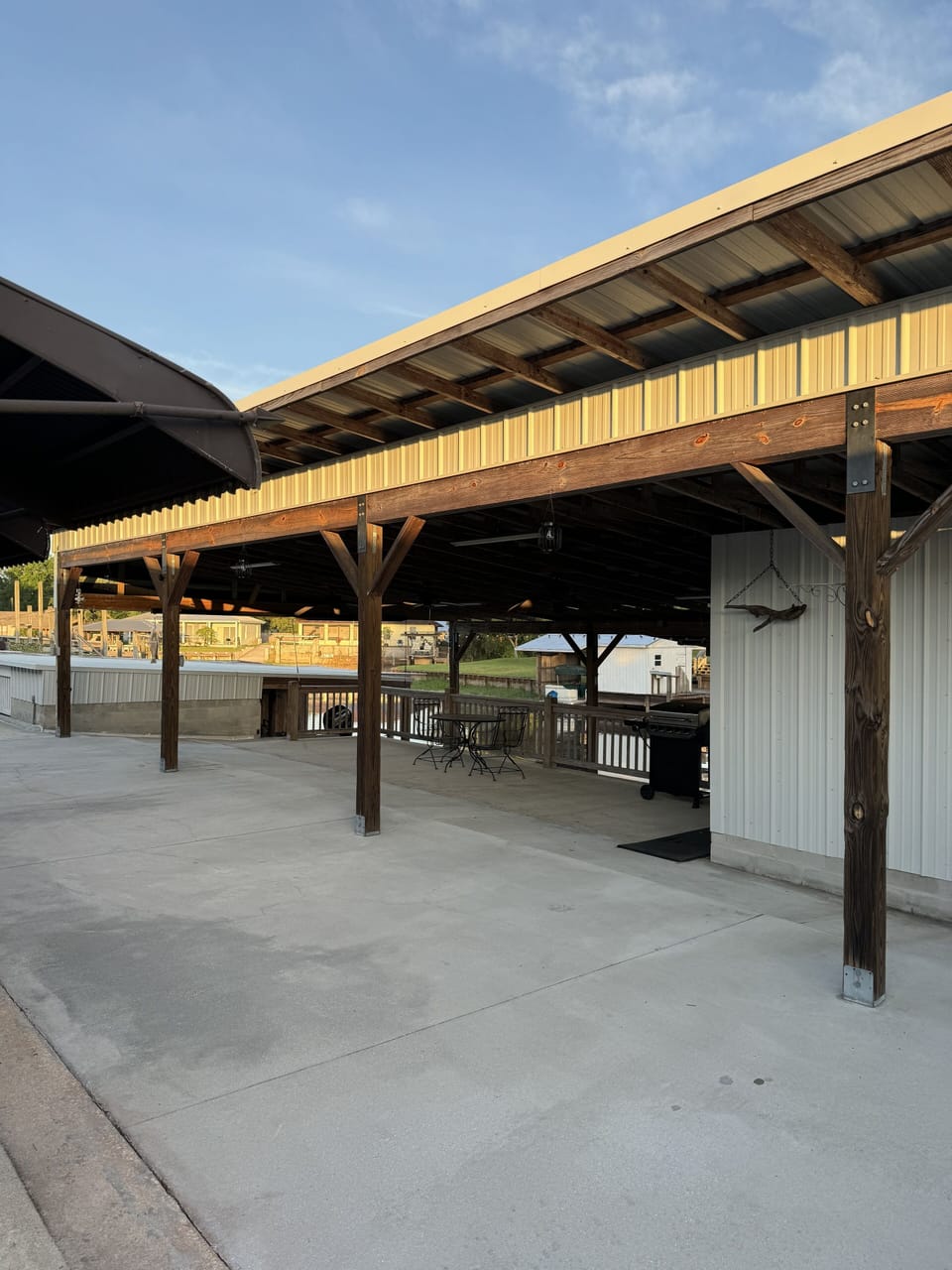 Outdoor covered patio area with grill