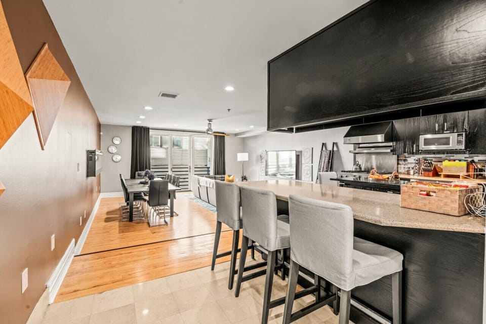 Bright Kitchen and Dining Area Flowing into Comfortable Living Space