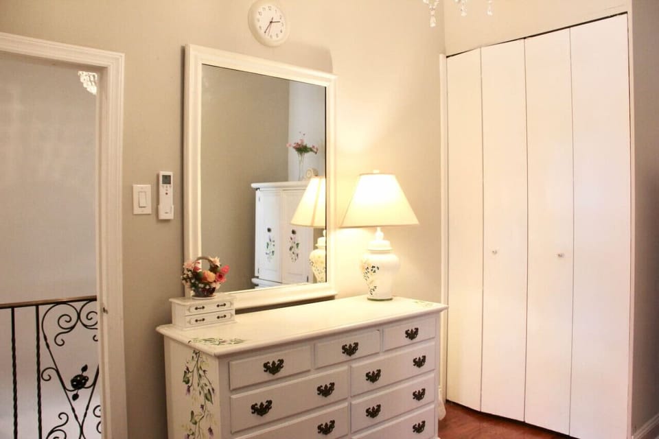 Charming Corner Featuring Elegant Lamp and Dresser