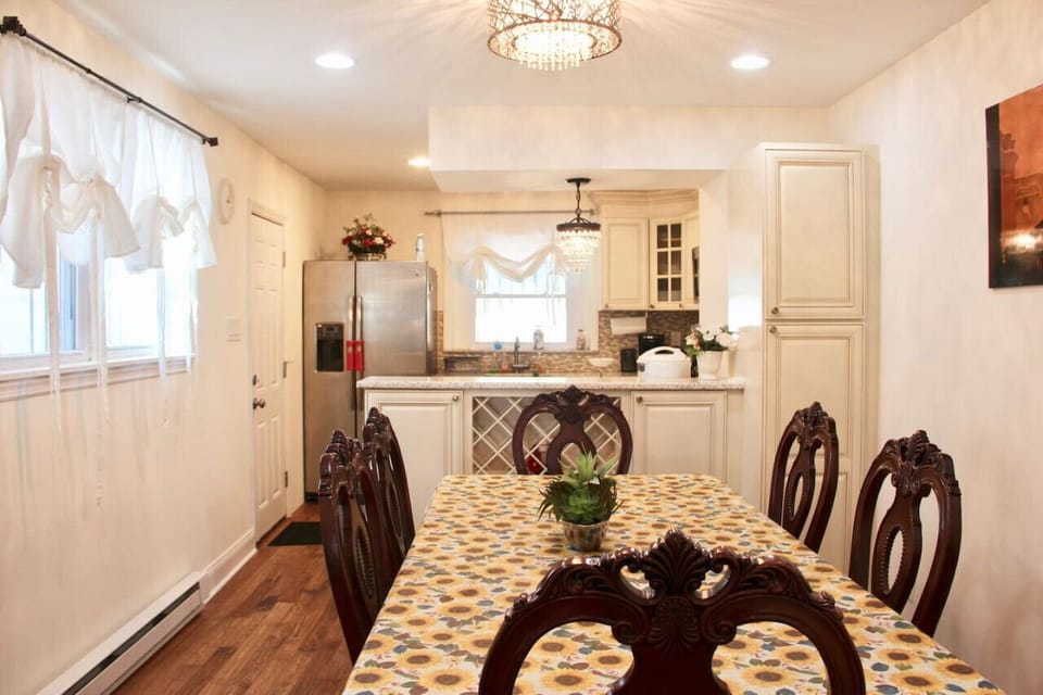 Charming Dining Space Featuring Timeless Decor and Natural Light