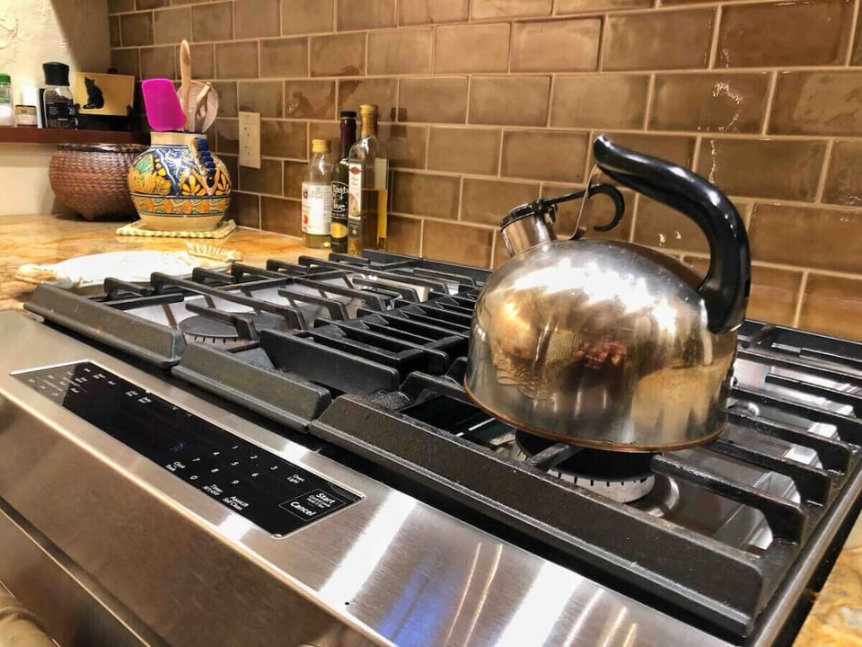 Cozy kitchen vibes with a classic stovetop kettle ready for your next brew!