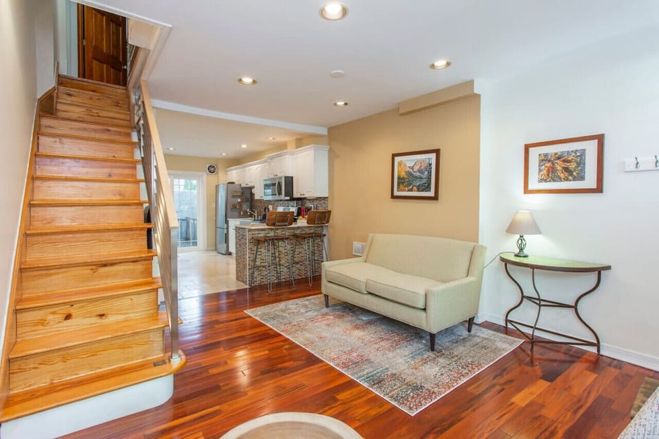 Cozy Open-Plan Living Space with Wooden Staircase