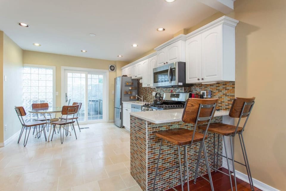 Spacious Kitchen with Modern Appliances and Open Dining Space