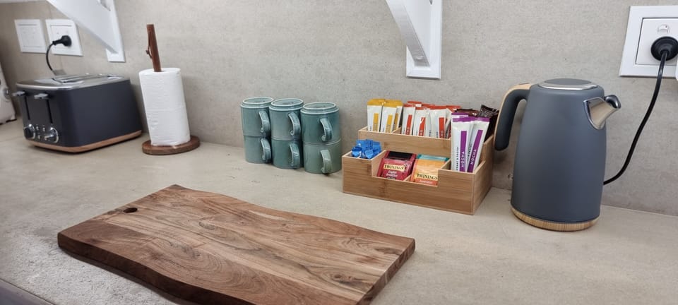 Fully stocked coffee bar now with a milk frother.