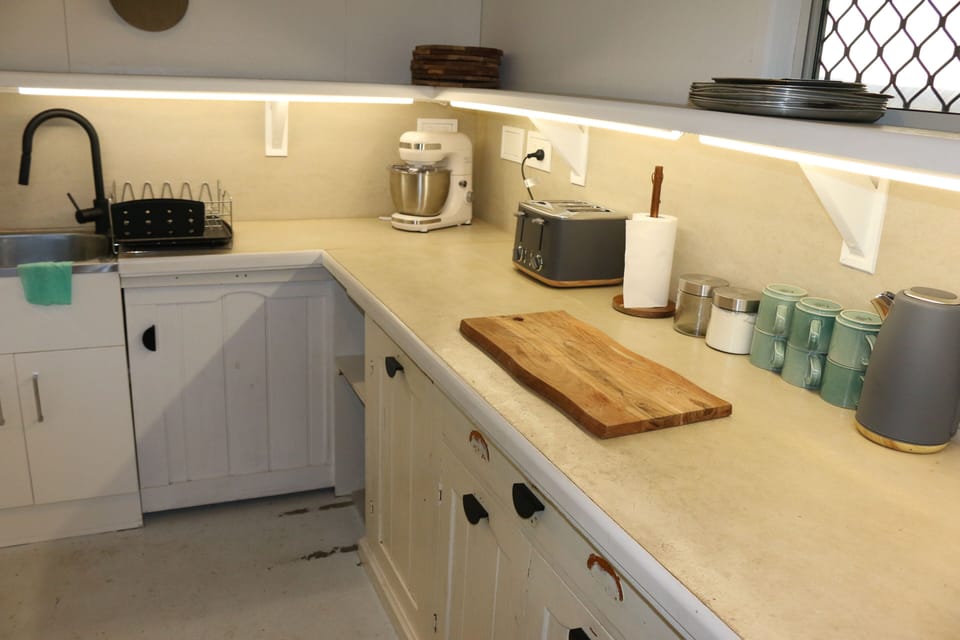 Stand mixer, kettle, toaster, coffee frother. 
