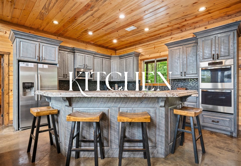 Whip up a feast in this fully stocked, chef-worthy kitchen — double ovens, granite counters, and plenty of island seating for the crew.