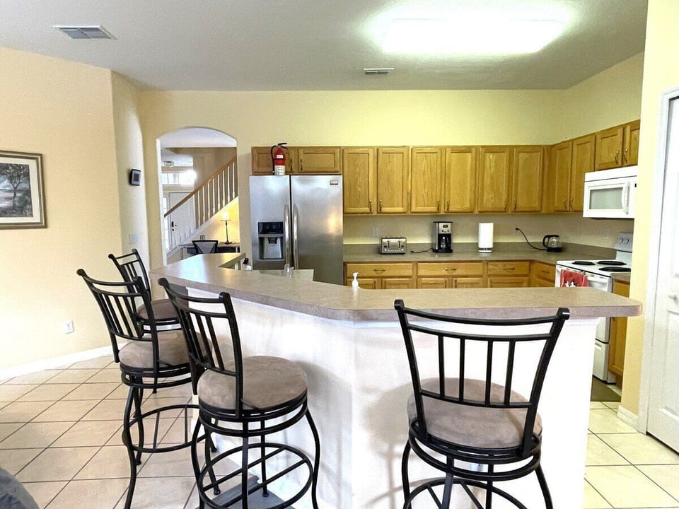 Prepare family meals in the fully equipped kitchen with plenty of counter seating
