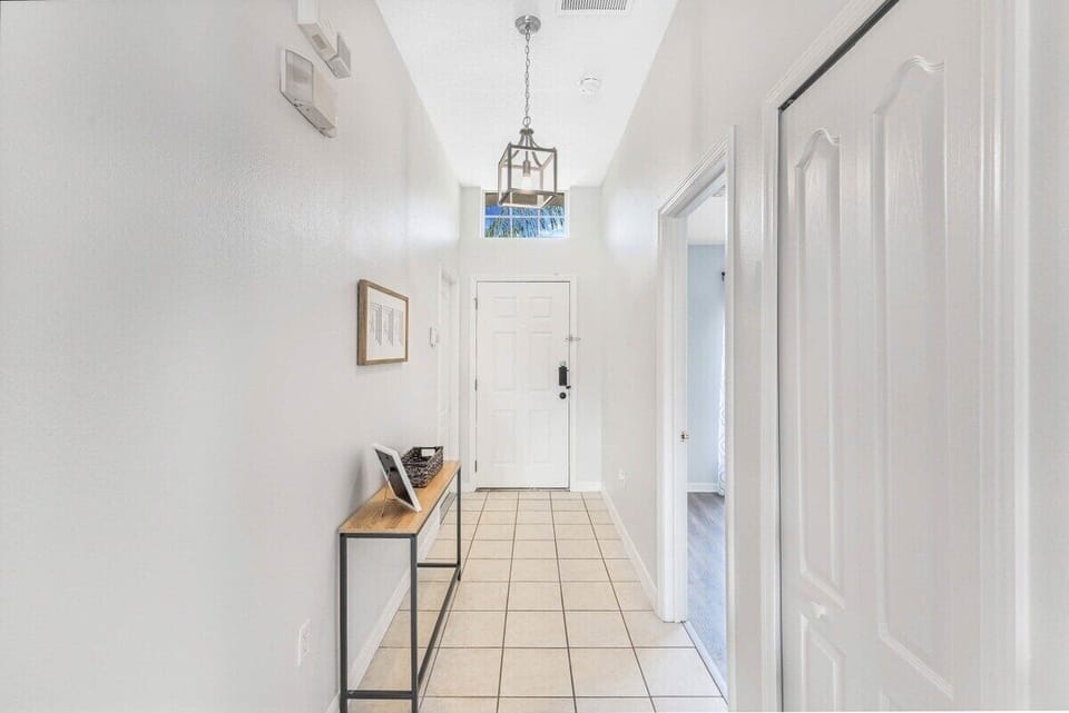 Step into a bright and inviting foyer that leads you straight into your Florida vacation. Our home is designed with a clean, modern aesthetic to help you feel at home the moment you arrive.