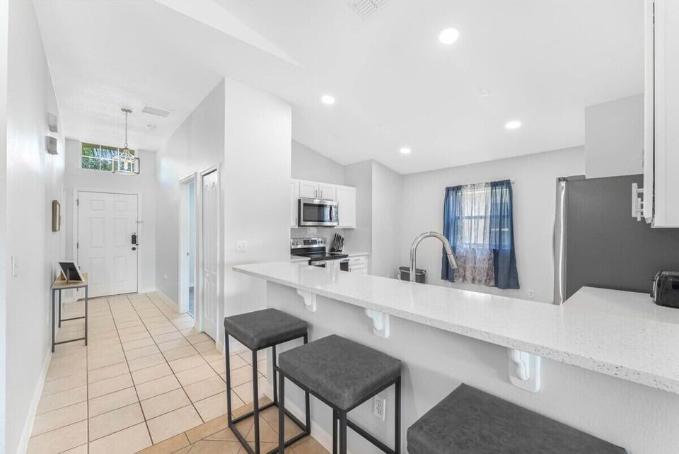 Start your day at the breakfast bar in our fully equipped kitchen. The open layout ensures you never miss a moment of the conversation while preparing meals.