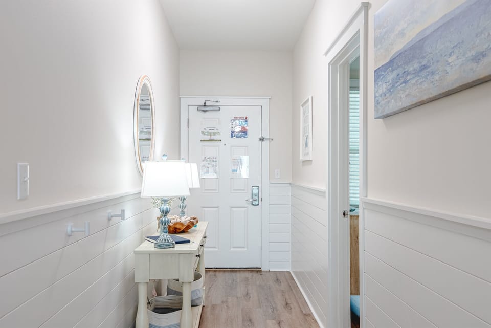 Simple, welcoming entry with space to drop bags and settle in.
