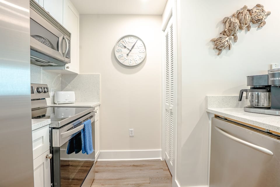 Compact, well‑organized kitchen with stainless appliances and everything you need for easy meal prep.