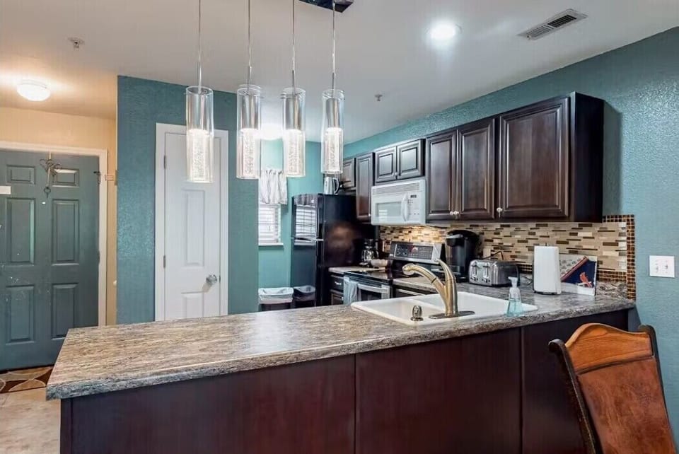 Get inspired to cook and entertain in the stylish and fully equipped kitchen, complete with all the modern amenities you need to whip up a delicious meal