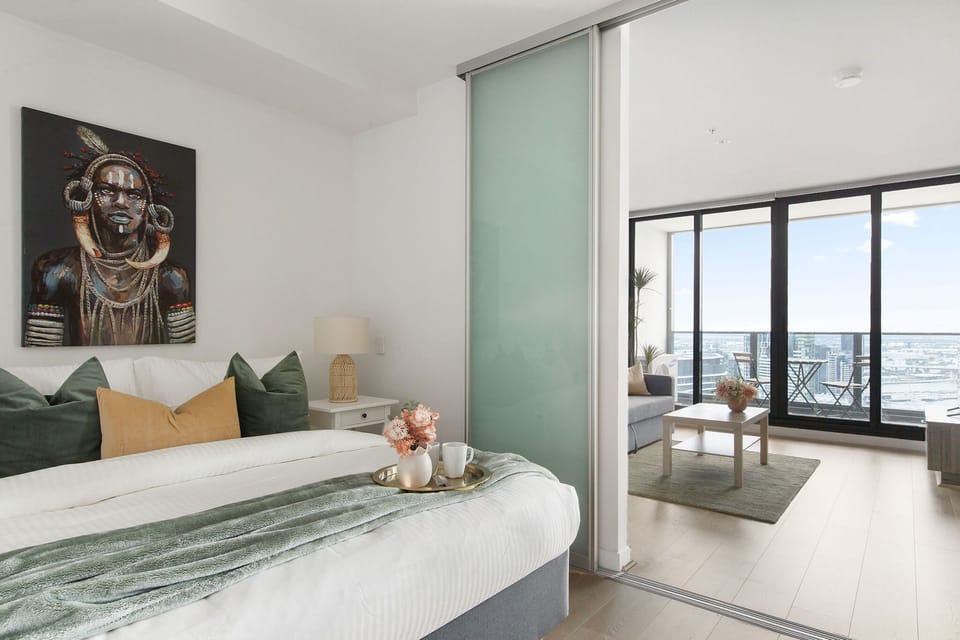 The 2nd bedroom with a queen sized bed & plush pillows.