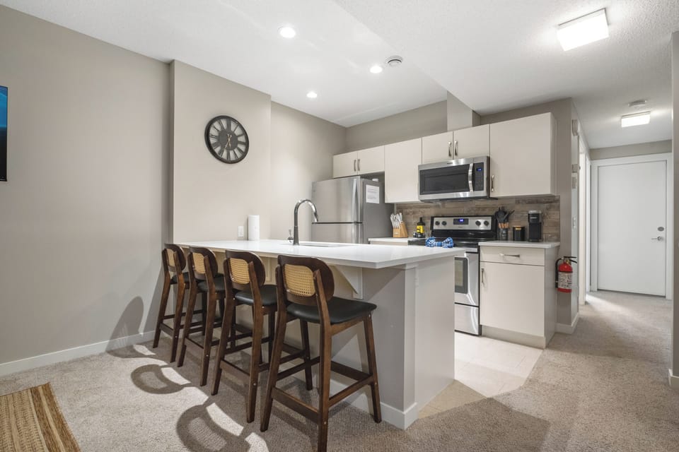 Spacious kitchen island with bar seating—great for meals or casual dining.