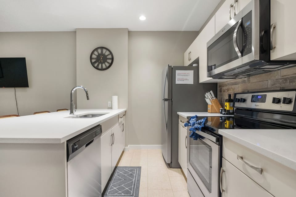 Fully equipped kitchen with modern appliances and ample counter space.