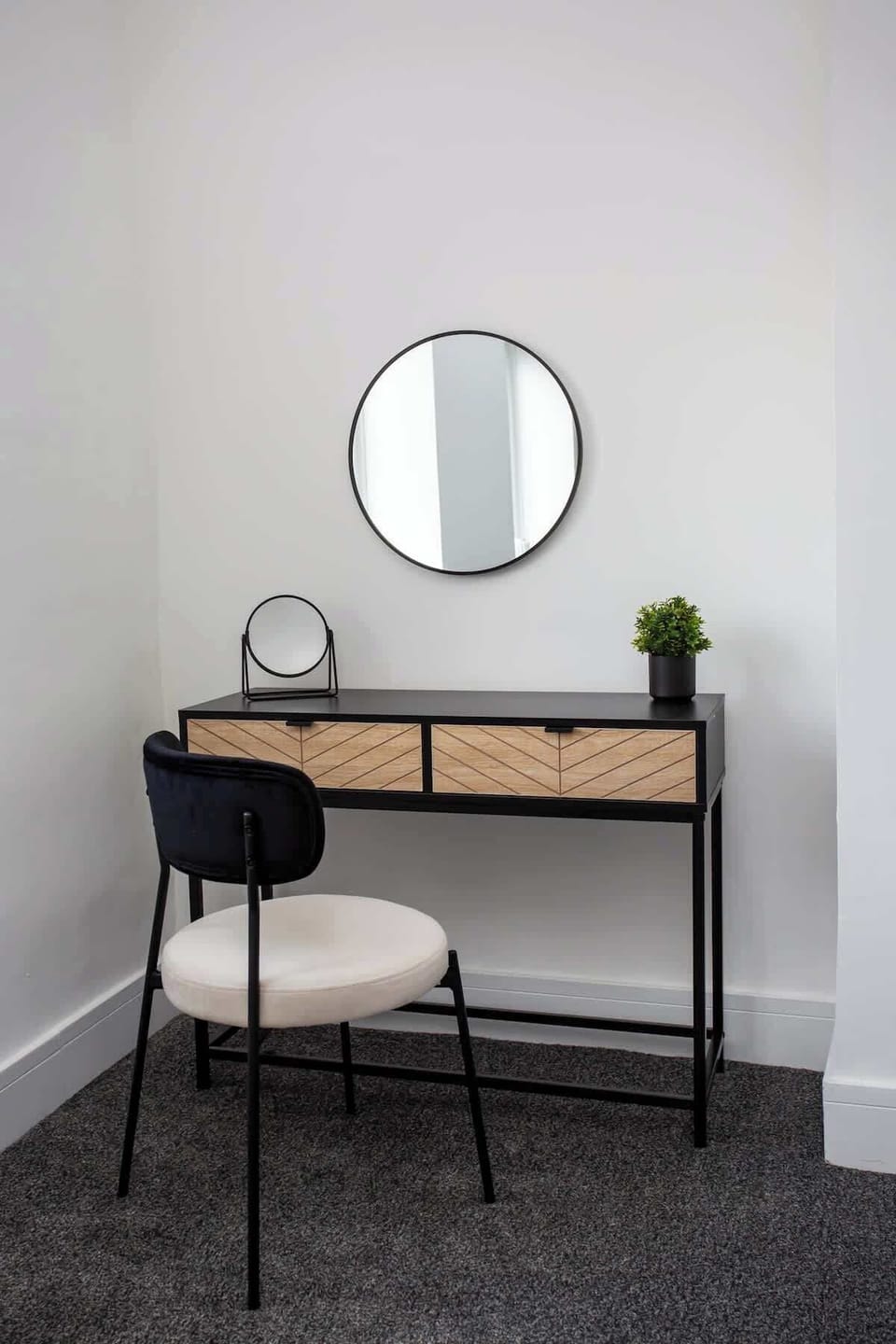 This dressing table is typically adorned with a large, clear mirror framed by lights and decorative elements, it serves as a focal point for your dressing