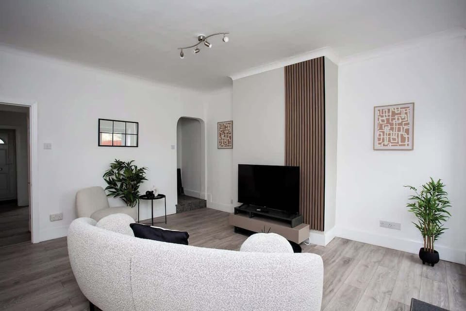 Sink into the plush sofa and lose yourself in a movie marathon or catch up on your favorite shows in style.