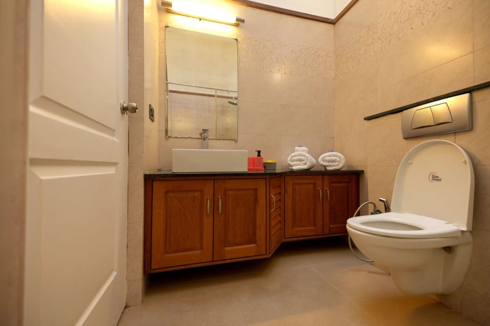 Shower, slippers, bidet, towels