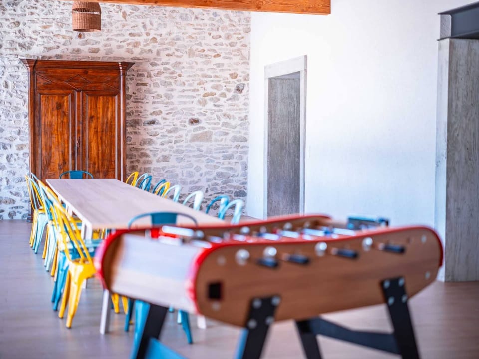 Large covered veranda/terrace with dining area and games area with table football - Sofas