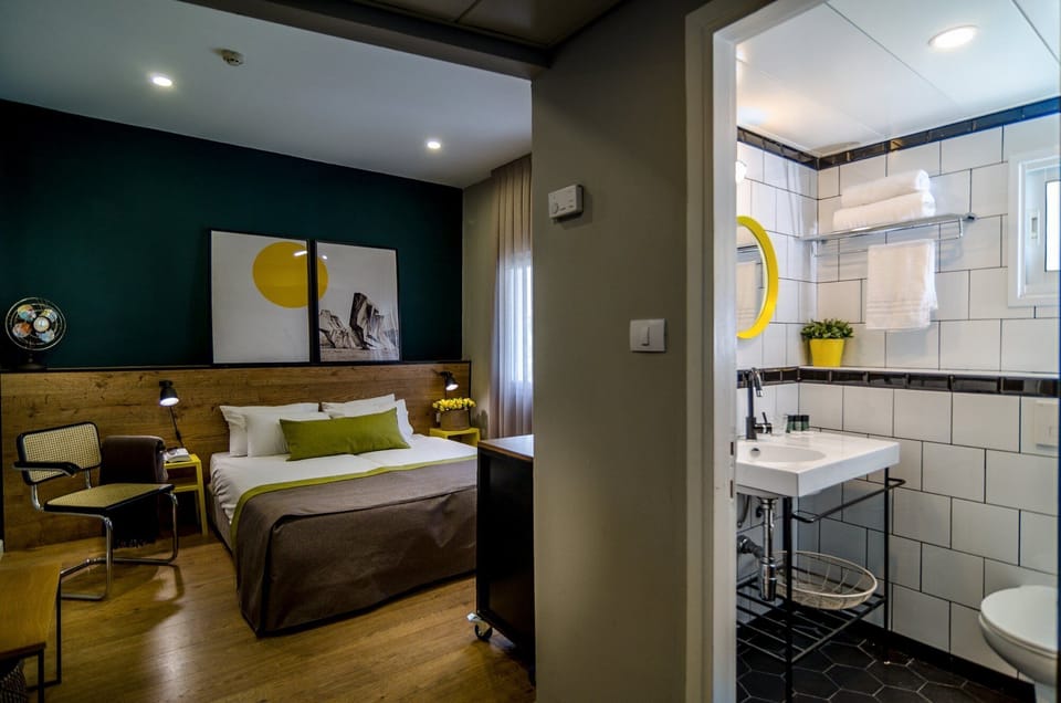 Deluxe Studio Suite, Balcony, City View | Individually decorated, individually furnished, desk, laptop workspace