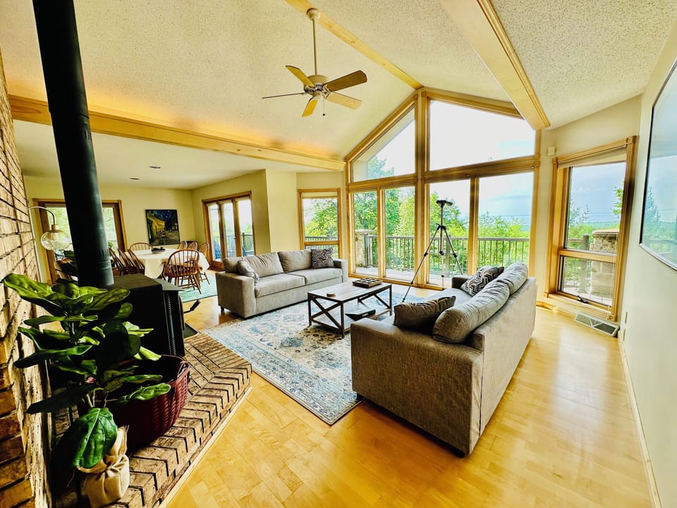 Spacious Living room with Floor-to-ceiling windows for natural lighting