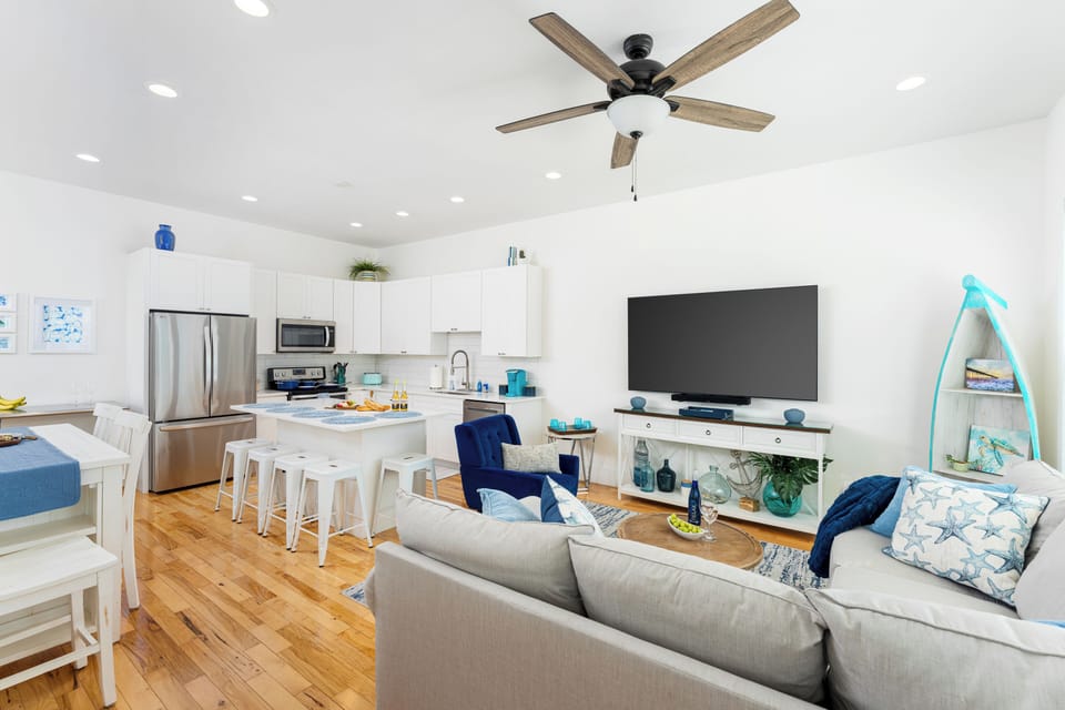 Open-concept living area with 10-foot ceilings - perfect for gatherings.