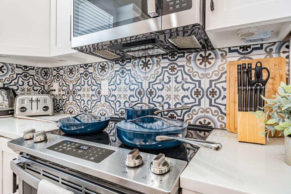 Our fully stocked kitchen with stainless steel appliances, high-end kitchen cookware, knife set, cutting board, toaster, coffee maker, and so much more allows you the ability to cook full meals or just enjoy the takeout you brought home.