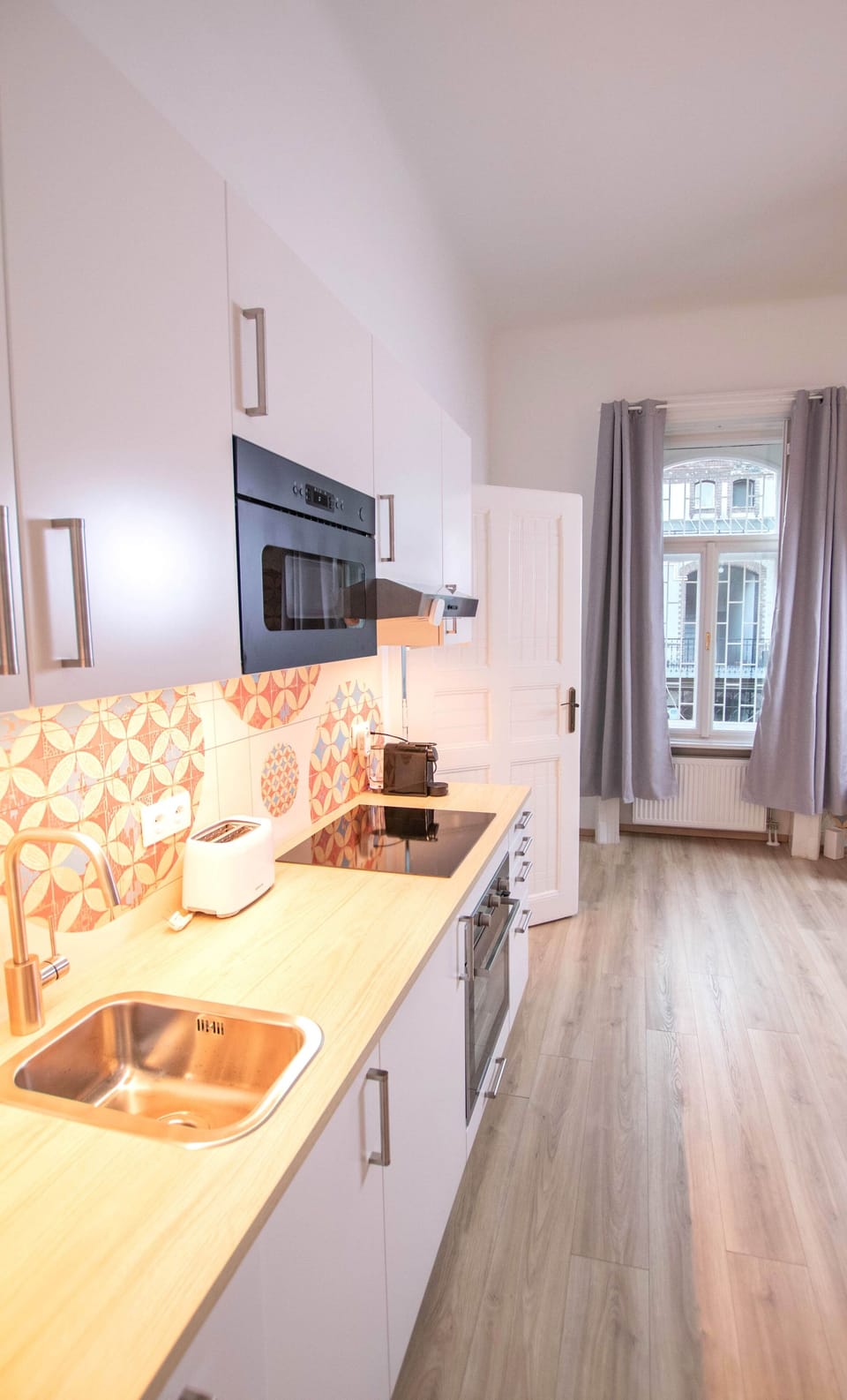 Fitted kitchen with courtyard view