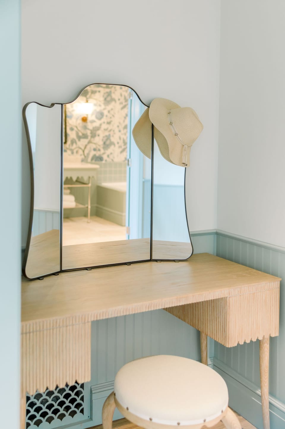 Start the day in peaceful reflection at a charming vanity where soft tones and natural light set the tone.