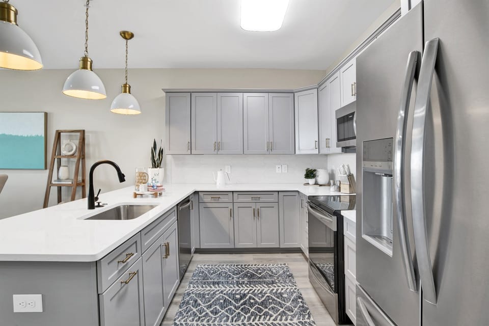 Discover culinary inspiration in this chic, modern kitchen, where state-of-the-art appliances meet elegant design for the ultimate cooking haven.