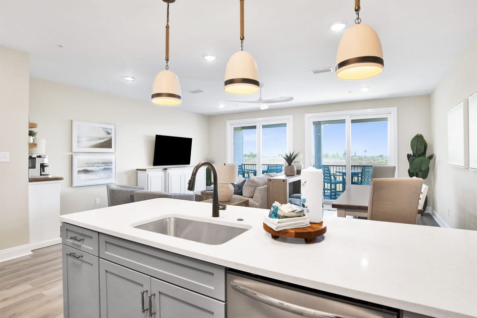 A chic culinary space opens up to breezy waterfront views, merging indoor luxury with the serenity of the blu waters