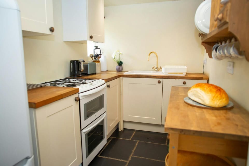 Kitchen with fridge/freezer and gas cooker