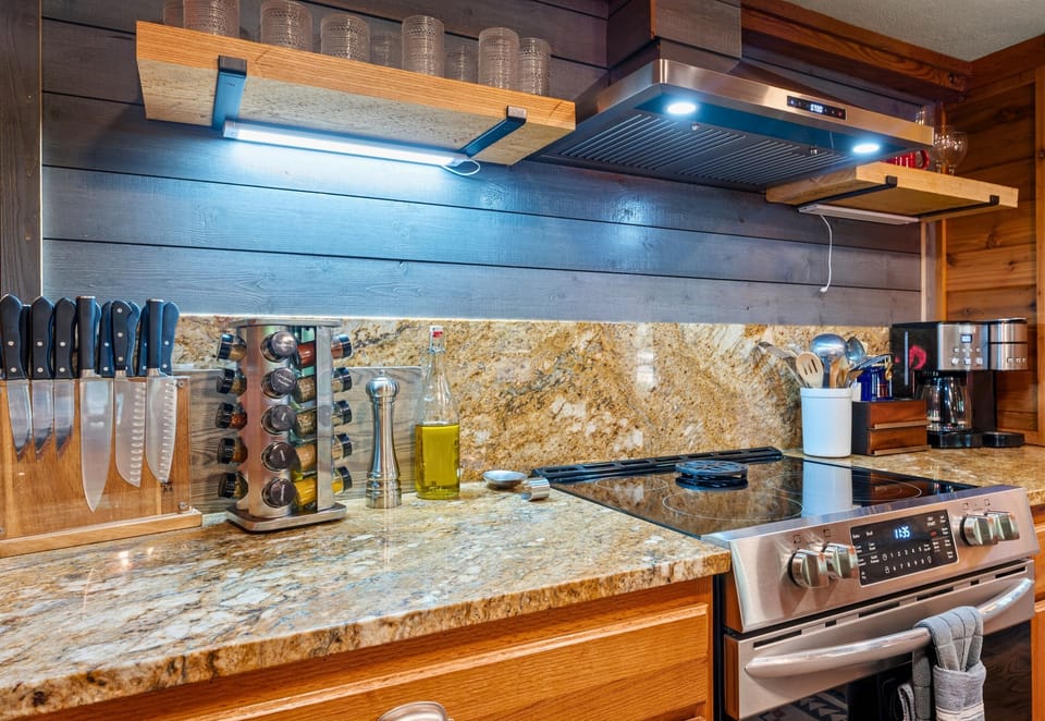 Enjoy cooking in a beautifully designed kitchen that combines rustic charm with modern amenities.