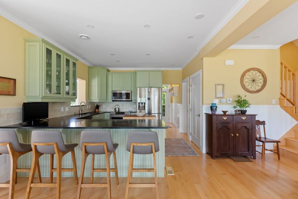 Beautiful and modern open concept kitchen/dining/living room areas (Spruce Ledge Home)