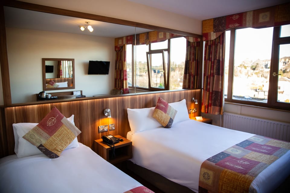 Standard Triple Room | Desk, laptop workspace, blackout drapes, iron/ironing board