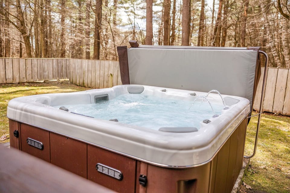 Experience luxurious relaxation in our brand new hot tub, nestled in a serene backyard oasis offering ultimate privacy. 
