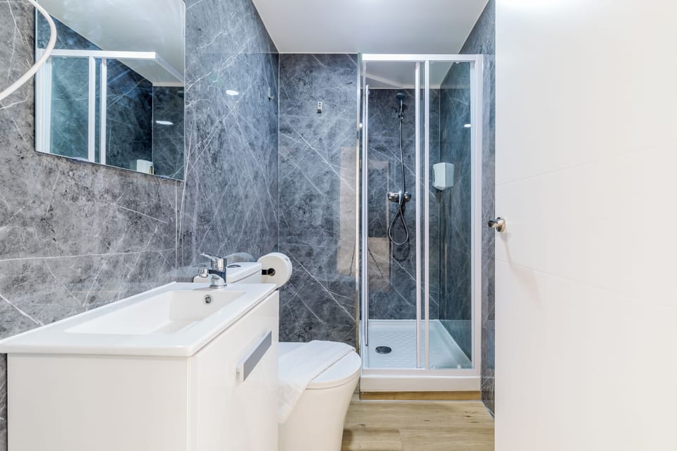 Basic Double Room, Non Smoking, Shared Bathroom | Bathroom | Shower, hair dryer, towels, soap