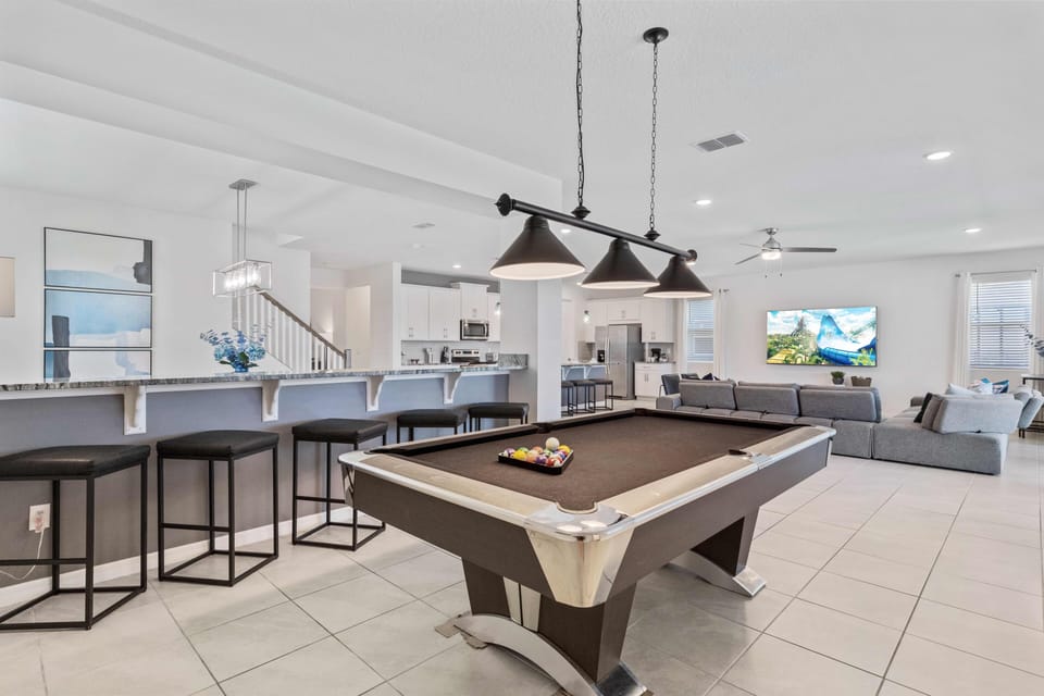 Keep the fun going with a pool table in the comfort of your vacation home in Kissimmee - Entertain guests with a game of pool in our inviting living space. - Enjoy hours of fun and laughter with your loved ones.