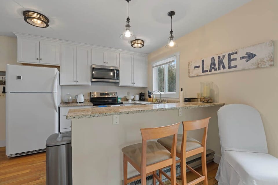 Fully stocked kitchen includes counter seating for 2