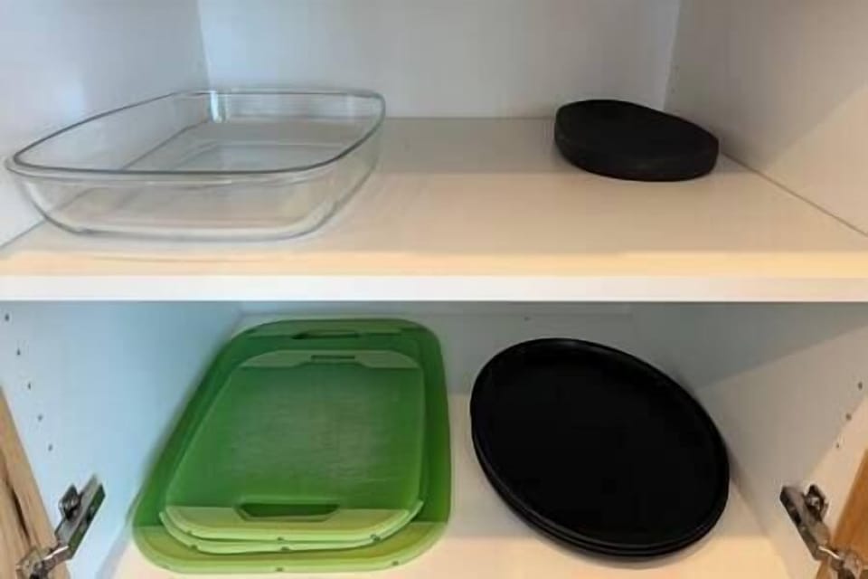 Kitchen with cutting boards and glass casserole dish.